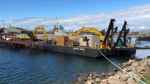 Construction equipment on floating barge at Windara Reef